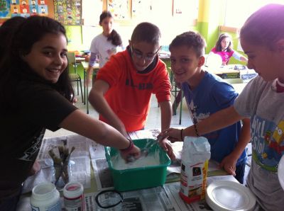 The sixth graders are making their Halloween masks
