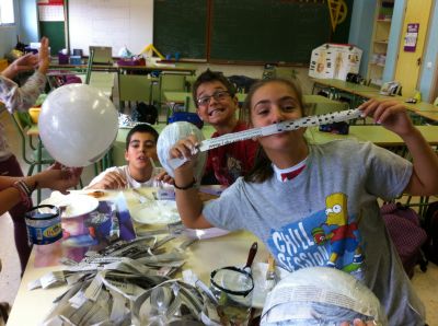 The sixth graders are making their Halloween masks
