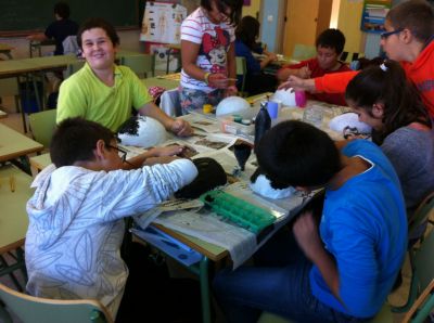 The sixth graders are making their Halloween masks
